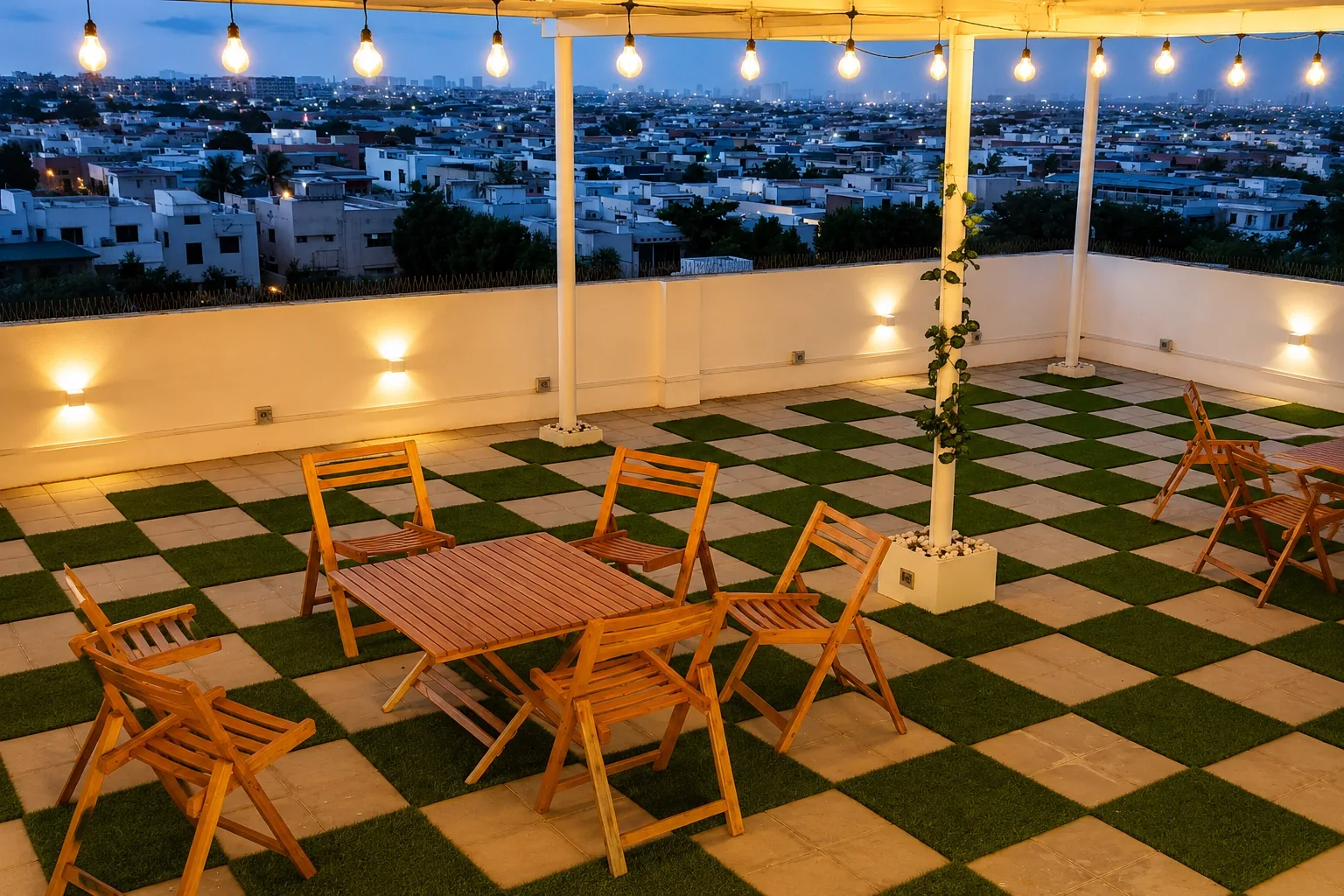 SkyView Space, SpaceShare's rooftop workspace at dusk with festoon lights